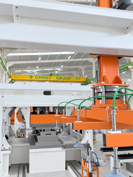 Orange and white DMMET MEXA automated sheet metal handling machinery